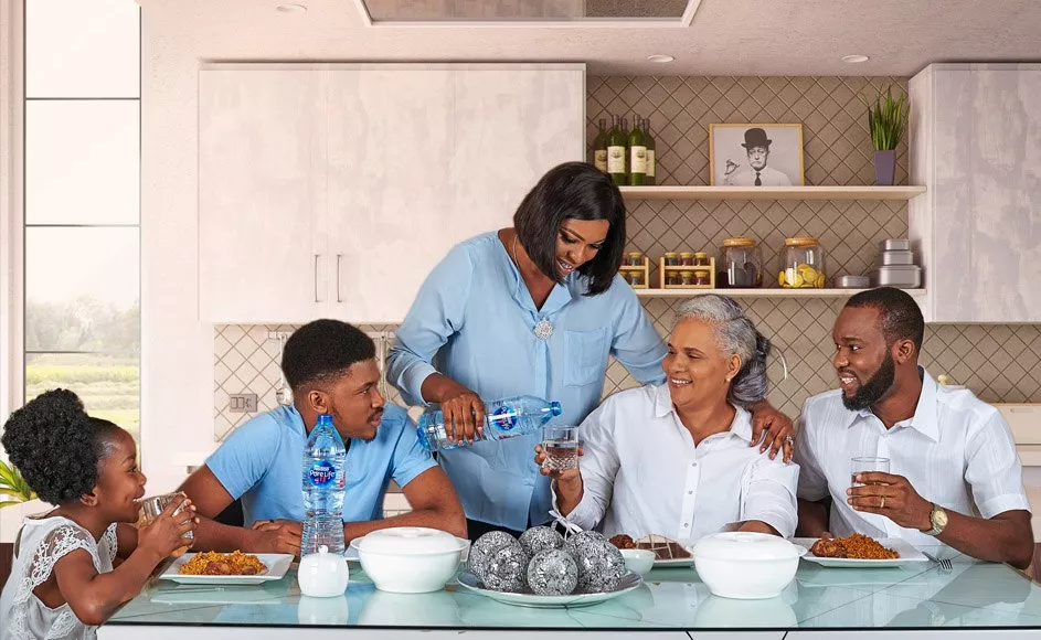 Family sharing a bottle of Nestle Pure Life Premium drinking water